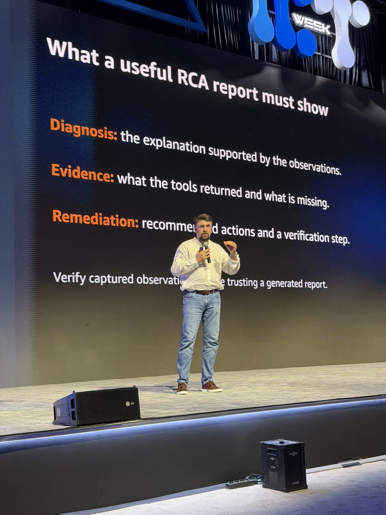 Viktor Vedmich in front of the slide What a useful RCA report must show: diagnosis, evidence, remediation